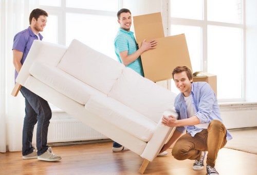 Moving furniture through a residential street in Earlscourt