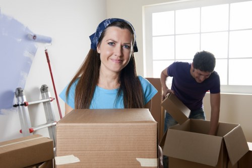 Professional removals team handling furniture in an Earlscourt property