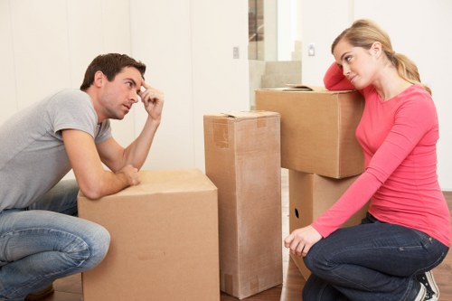 Manager reviewing workplace safety procedures during a move