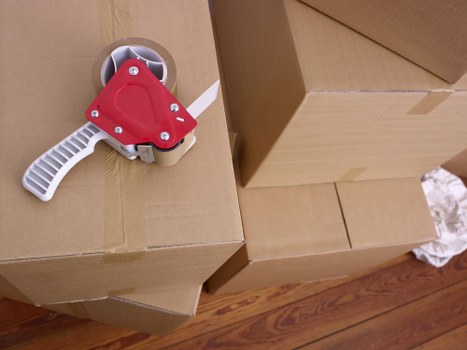 Commercial office move preparation with labelled boxes and equipment