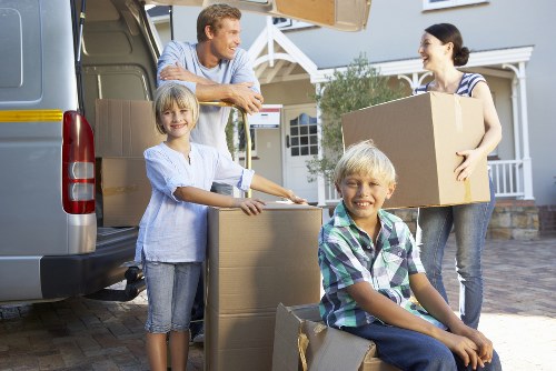 Furniture being carefully loaded into a removals van for an Earlscourt property