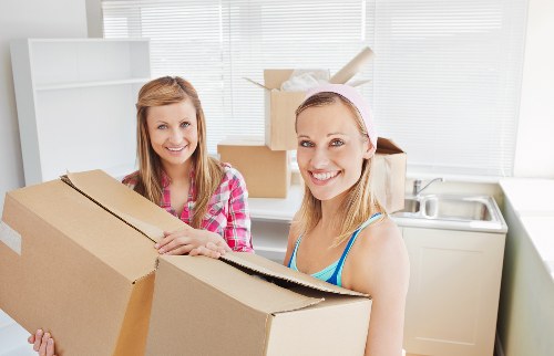 Home movers working in a flat with stairs and narrow access in Earlscourt